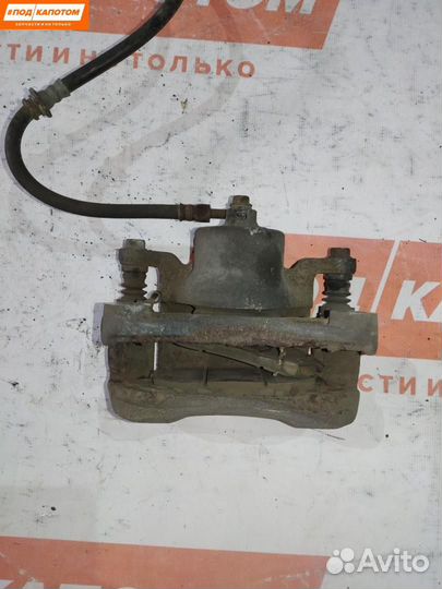 Суппорт тормозной передний левый Nissan Teana J32