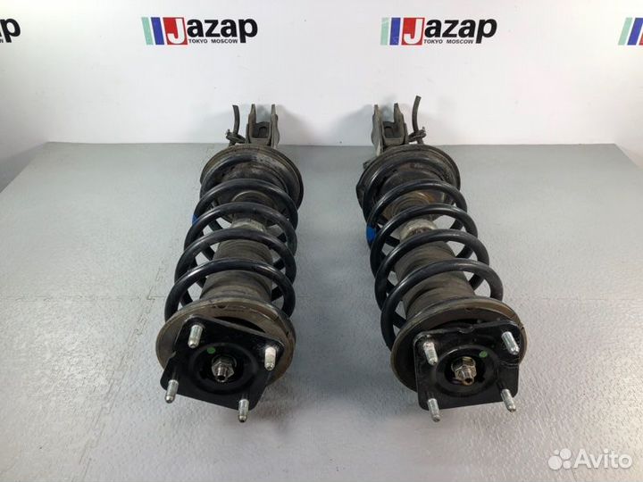 Стойка передняя оригинал Mazda CX7 ER 4wd б/п L+R