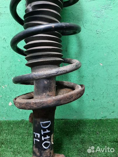 Стойка амортизатора передняя левая Suzuki Grand V