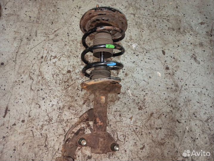 Стойка подвески передняя левая Nissan Primera P12