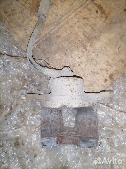 Суппорт тормозной передний левый Daewoo Nexia