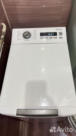 Стиральная машина с вертикальной загрузкой