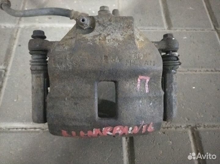 Суппортf тормозные передние Nissan Almera n16