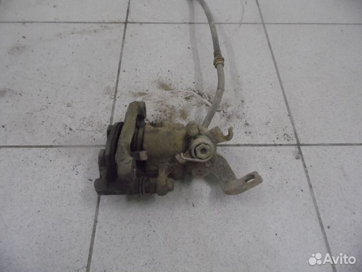 Суппорт тормозной задний левый Hyundai Elantra 200