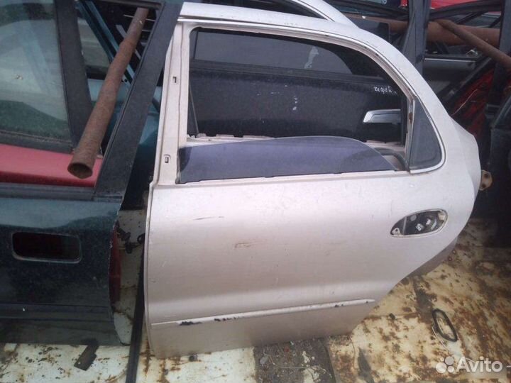 Дверь Kia Clarus