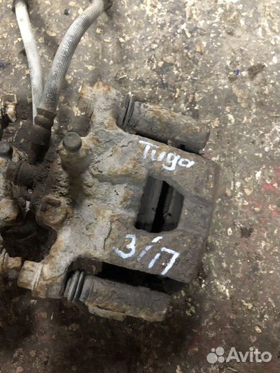 Задний тормозной суппорт Nissan Tiida 1