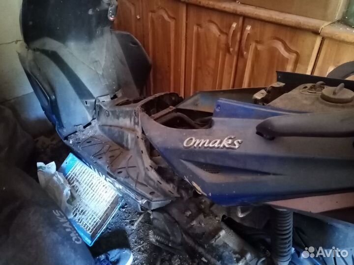 Скутер omaks