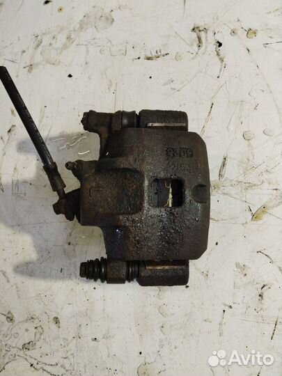 Суппорт тормозной передний левый Mazda 626 GD 1989