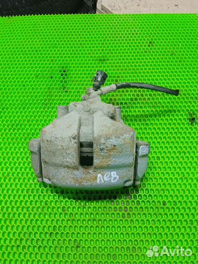 Суппорт левый volkswagen Passat B7 передний