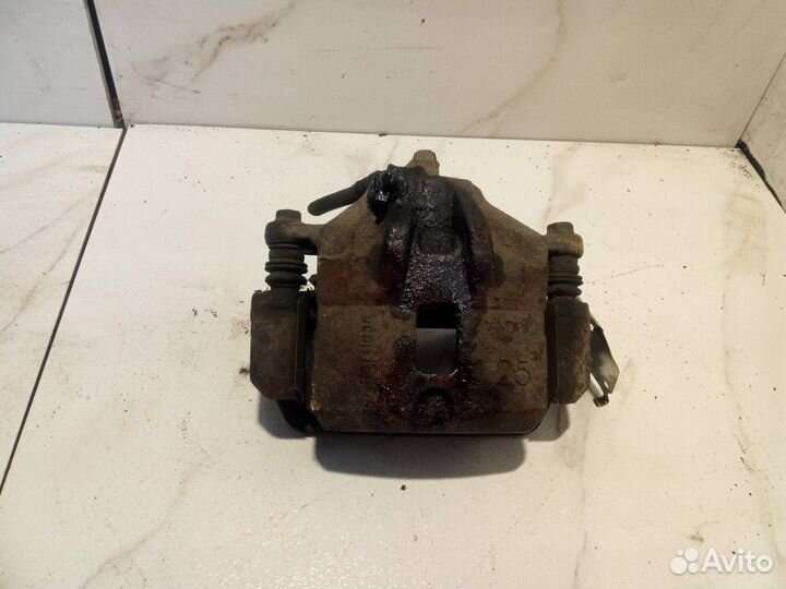 Суппорт тормозной передний правый Hyundai-Kia EF